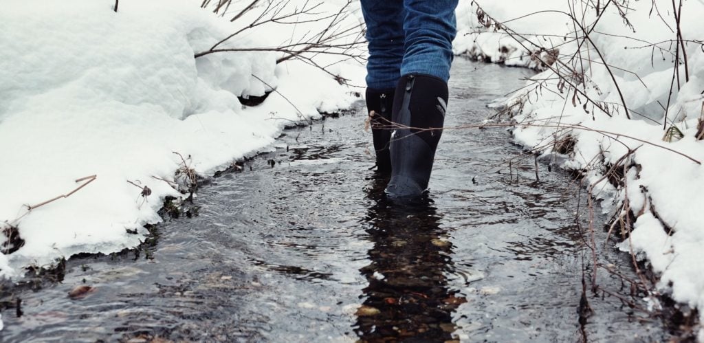 Person Wearing Dryshod Boots standing in stream